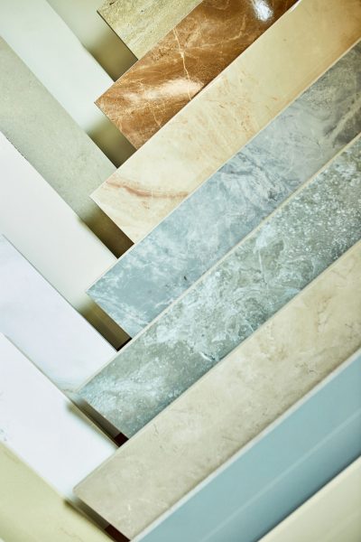 Various decorative tiles samples. Colorful samples of a stone tile in store. Copy space.